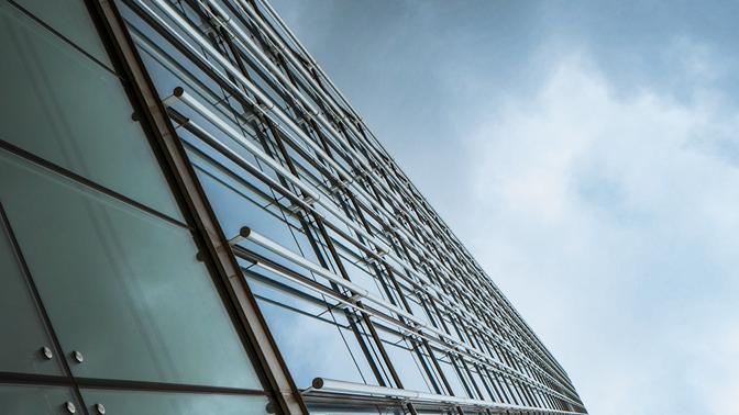 A modern glass and metal skyscraper, rotated 90 degrees